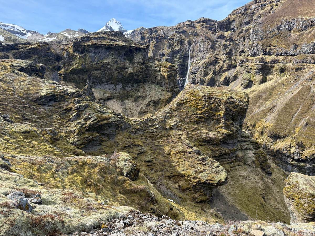 Mossy cliffs and a waterfall in Múlagljúfur Canyon, Southeast Iceland