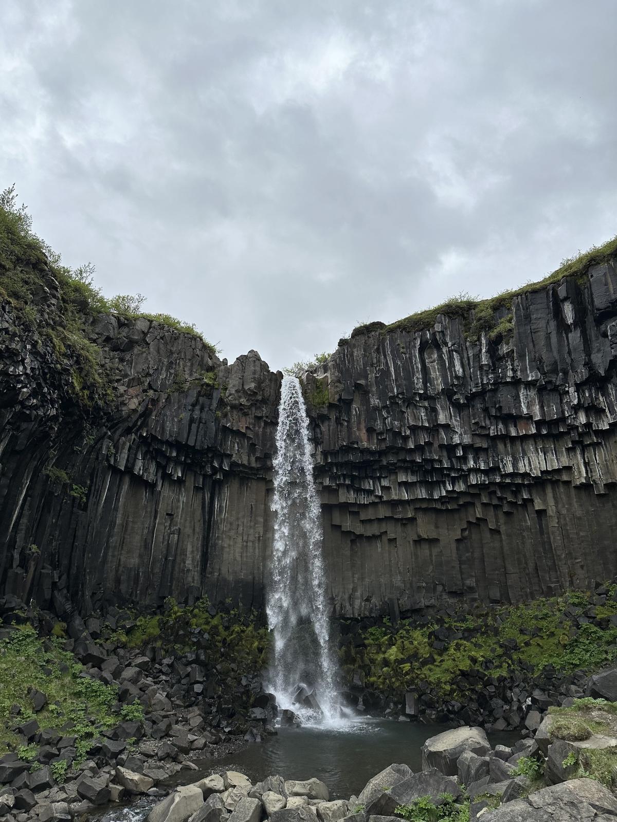 Svartifoss waterfall framed by black basalt columns in Skaftafell